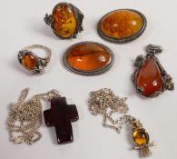 A collection of Amber jewellery to include necklaces, brooches, rings & pendant