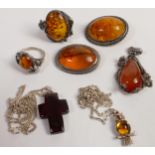 A collection of Amber jewellery to include necklaces, brooches, rings & pendant