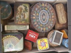 A mixed collection of vintage advertising tins