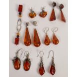 A collection of Amber Earring some with white metal mounts(7 pairs 1 (a/f))