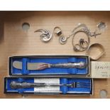 A collection of silver items to include silver handled pickle fork, silver handled table knife,