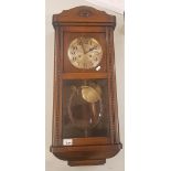 Early 20th century Oak cased Wall clock (pendulum and key present) 79cm High