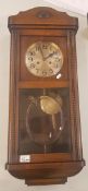 Early 20th century Oak cased Wall clock (pendulum and key present) 79cm High