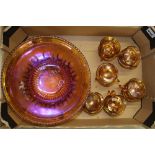 A large carnival glass punch bowl with full set of 12 punch cups.