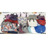 A collection of used Kipling Ladies Handbags & tote bags, two with matching scarfs (19)