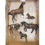 A group of Royal Doulton Horse Figures to include swish tail horse, stocky jogging mare, 3 foals all