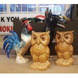 Pair of unmarked treacle-glaze Owls with glass eyes together with unmarked ceramic Rottweiler and