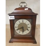 A mahogany cased 'Smiths' bracket clock, key and pendulum present.