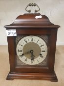 A mahogany cased 'Smiths' bracket clock, key and pendulum present.