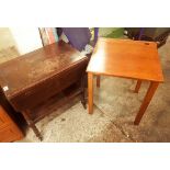 A mid century single hinged-top school desk, together with an oak trolley table (2).