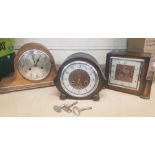 Three Oak Cased Mantle clocks to include two Smiths examples and one unnamed. Pendulums and keys