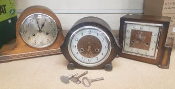 Three Oak Cased Mantle clocks to include two Smiths examples and one unnamed. Pendulums and keys