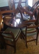 Circular extending dining table and 6 chairs, 74cm H x 107cm diameter.
