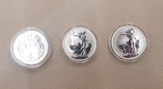 A group of 3 One Ounce Britannia Silver Coins dated 1998, 2006 and 2008
