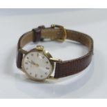 Garrard ladies 9ct gold cased wristwatch, winds, sets, ticks & runs. Good condition.
