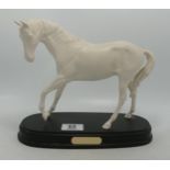 Royal Doulton white horse spirit of youth on wood plinth, the plinth signed by Michael Doulton 1994.