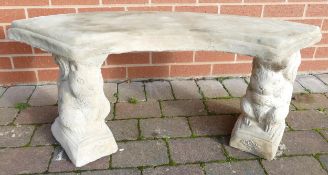 Stone garden ornament of a Squirrel seat, curved seat on squirrel plinths