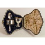 Silver child's christening set comprising egg cup, spoon and serviette ring, 64.7g, in original box.