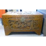 Oriental syle carved wooden Chest. H60cm x W102cm x D53cm.