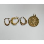 Three odd 9ct gold earrings, together with 9ct gold St. Christopher having white gold or silver