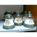 Wade Ceramics, a collection of Bells Christmas Whiskey Bottle Decanters, These items were removed