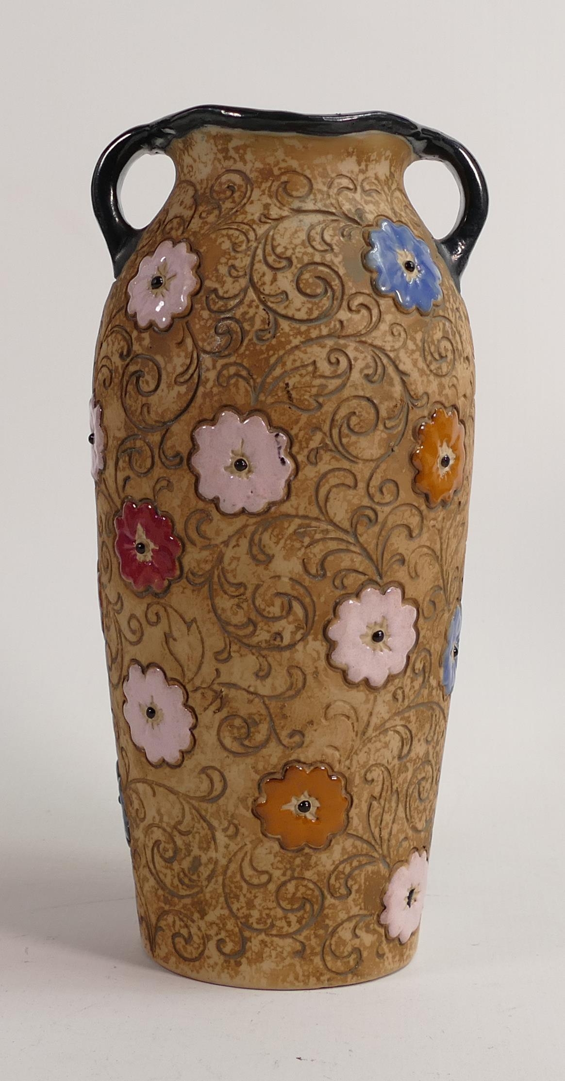 Amphora Pottery Tall Twin Handled Vase decorated with Flowers. Height 27cm.