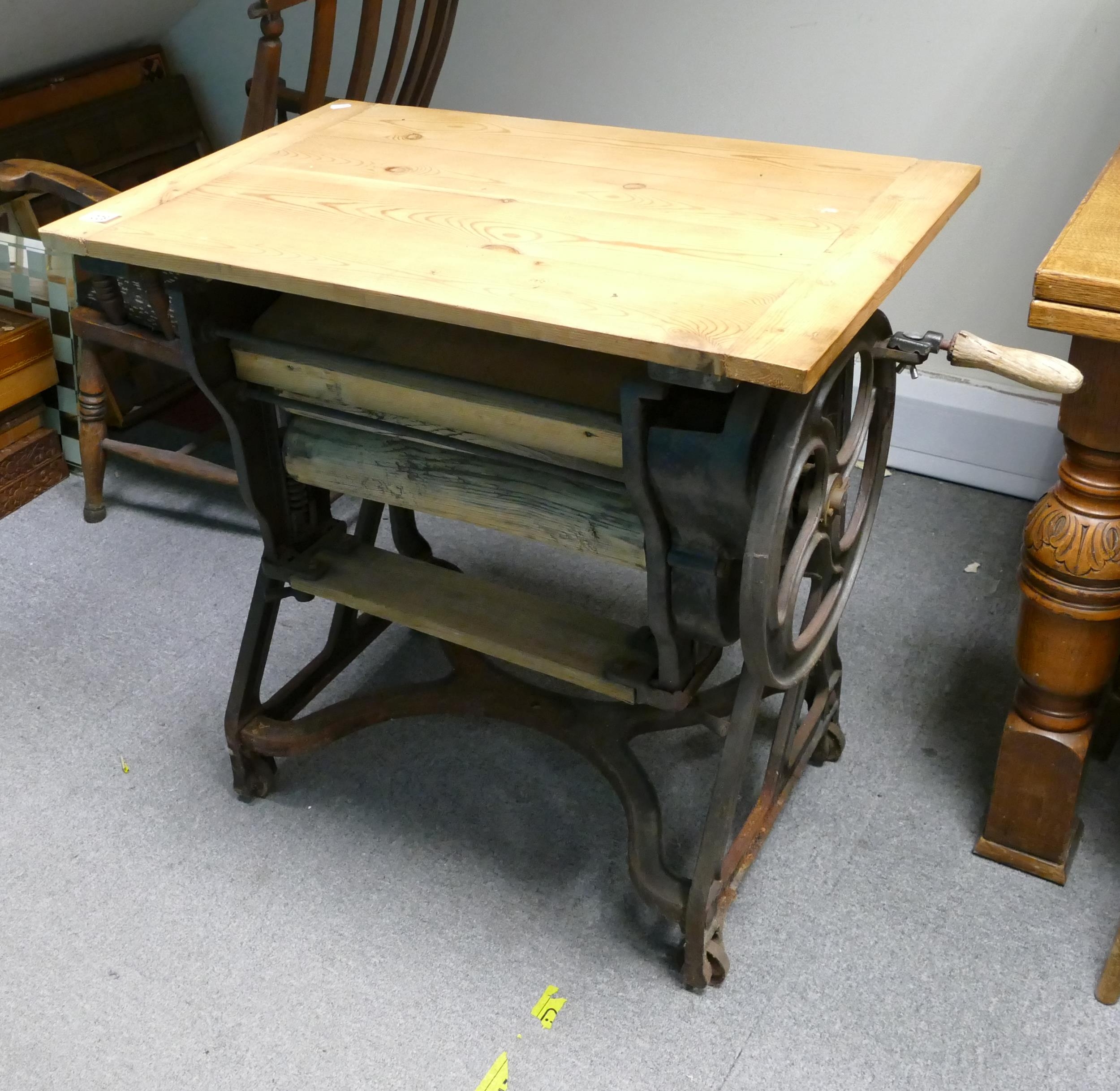 19th Century Cast Iron Mangle on wheels, converted into an ocassional table (pine wood). 80.5cm in