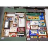 A collection of Boxed Die Cast Model Harrods , Corgi & similar model Vehicles(2 trays)