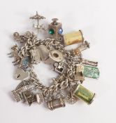 Silver vintage charm bracelet with appx. 28 charms, including £1 & 10/- note charms, weighing 108.2g
