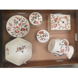 A collection of Wade floral patterned items to include a mantel clock, jug, lidded boxes etc (1