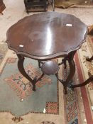 Early 20th century side table, shaped top and stretchered base, 60cm dia.
