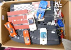 A collection of early scalextric , tracks and cars