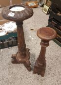 Two carved hardwood torcheres, height of tallest 75cm (2).