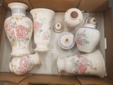 A collection of Wade floral patterned items including vases, trinket pots, lidded vases etc (1