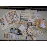 A large collection of loose World stamps and stamp albums (Viewing highly recommended) together with