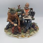 Capodimonte Figure of two tramps sat on a bench