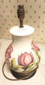 Moorcroft Pink Magnolia on cream ground large table lamp, 35cm in height overall.