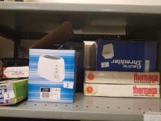 A large collection of house hold items to include boxed toaster, shredder, electric blankets,etc
