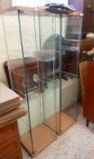 Two Ikea type glass display cabinets, 163.5cm in height.