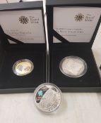 A cased Royal Mint 2008 £5 silver proof coin, together with a cased Royal Mint 2009 £2 silver