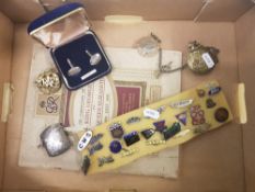 A mixed collection of items to include a sterling silver vesta case, RAF cap badge, group of lapel