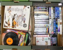 A mixed collection of items to include vintage LP's, singles and a large collection of VHS cassettes
