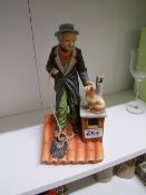 Capodimonte figure depicting a Chimney Sweep and cat on a roof, height 28cm.