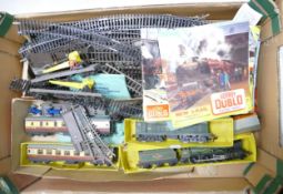 A collection of tri ang hornby oo gauge locomotives , tracks and carriages