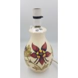 Moorcroft columbine on cream ground table lamp, 27cm in height overall.