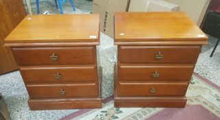 Pair of Ducal cherry wood bedside chests with plinth bases, 55cm in width.