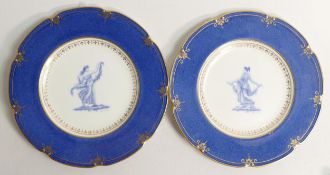 Two Wedgwood Neo classical cabinet plates. Circa 1891. Gilded on powder blue ground, with 22 Carat