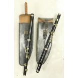 Two Regimental type cased piccolo instruments, length 38cm (2)