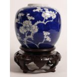 19th century blue & white ginger jar & stand decorated with Prunus, height on stand 17cm