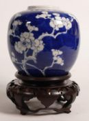 19th century blue & white ginger jar & stand decorated with Prunus, height on stand 17cm